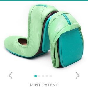 Two pairs of tieks flats size 5.